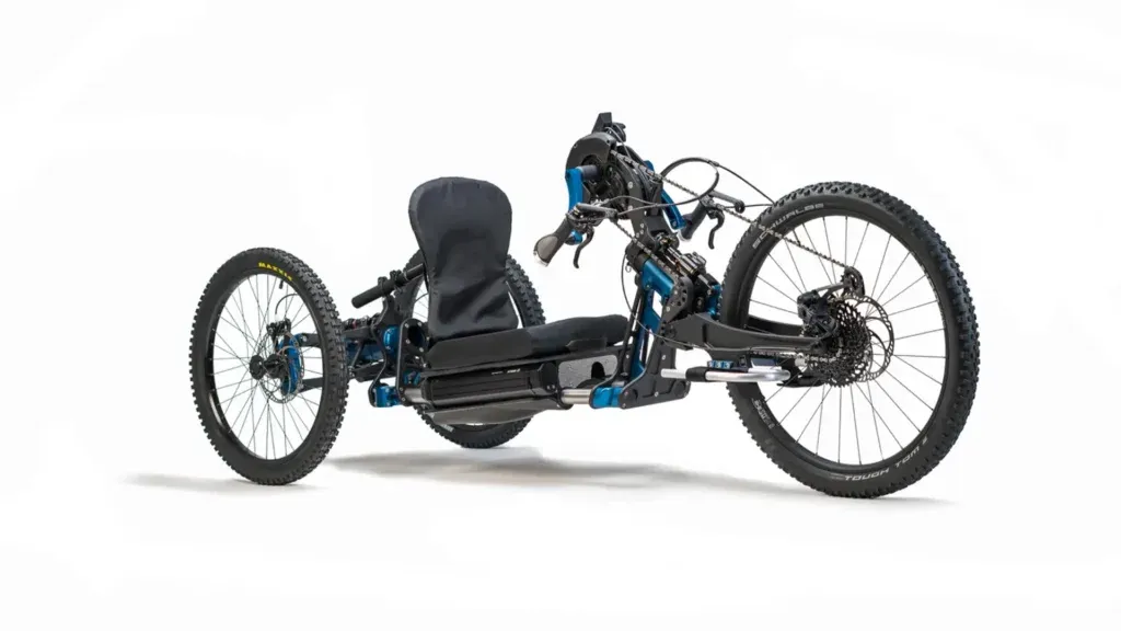 Off-road recumbent handcycle with large tyres, enabling disabled people to access outdoor activities, by our Community Interest Company.
