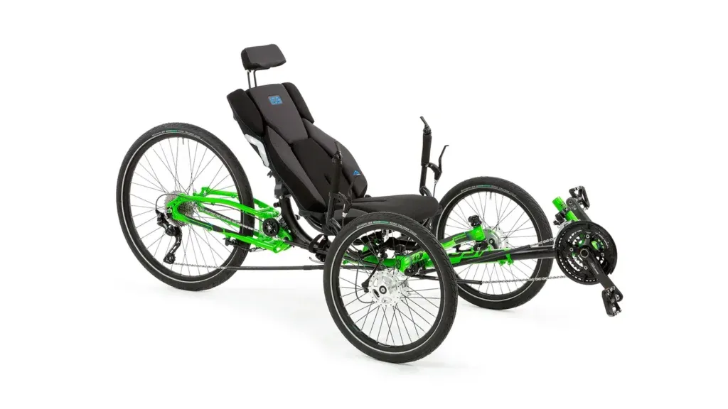 Accessible green and black recumbent tricycle with padded seat, ideal for disabled outdoor cycling at our not-for-profit CIC events.