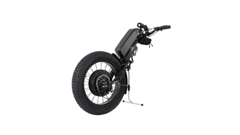 Klaxon Klick Monster 10 Adaptive electric bike with frame, battery, handlebars, and kickstand supports outdoor access for disabled people; white background.